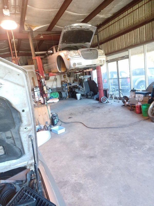 Clark's Automotive Repair vehicle on lift